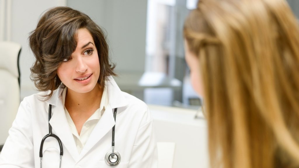 Doctor explaining diagnosis to her female patient